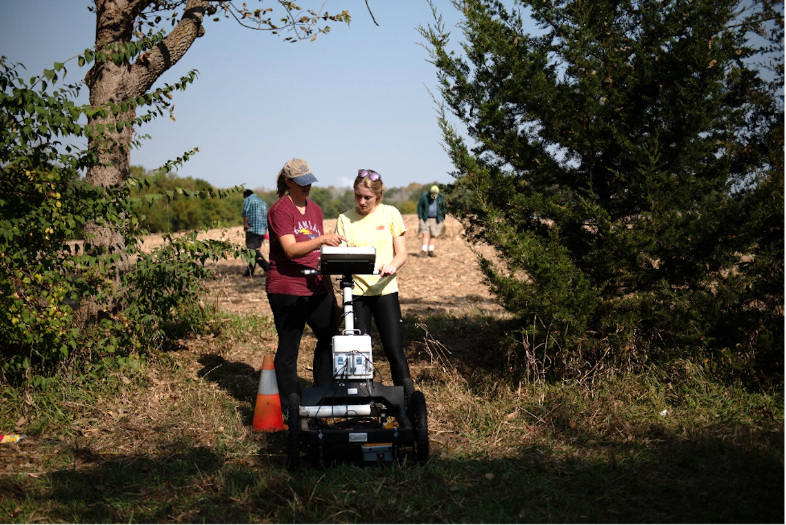 "Blair Schneider shows an undergraduate research assistant how to use ground-penetrating radar"
