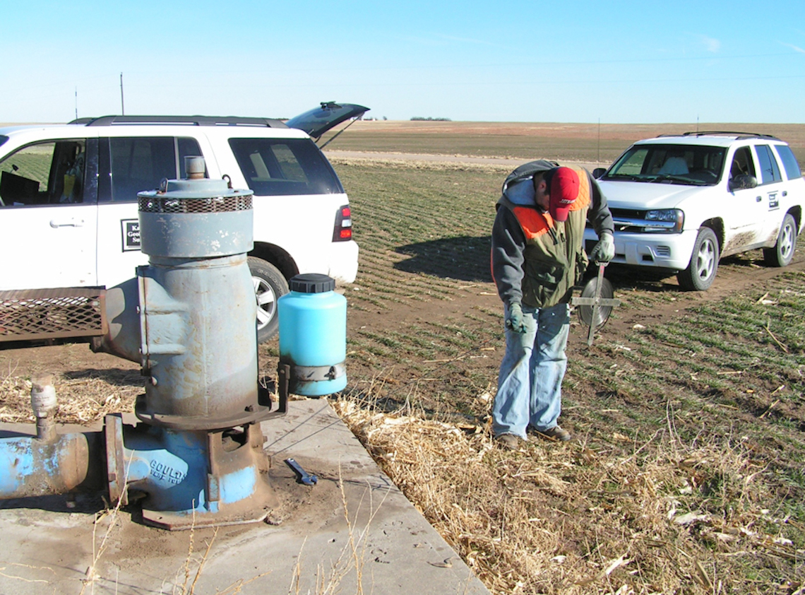 "A KGS scientist measures groundwater levels."